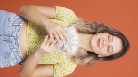 Vertical-video-of-The-young-woman-loves-money.